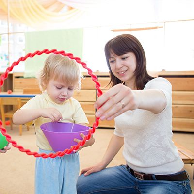 Caregiver with a toddler at Apple Valley