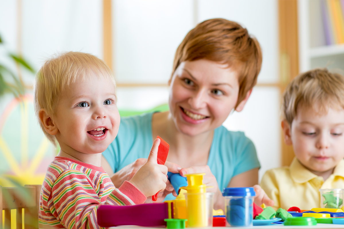 Angelica caring for children at Apple Valley Childcare & Preschool