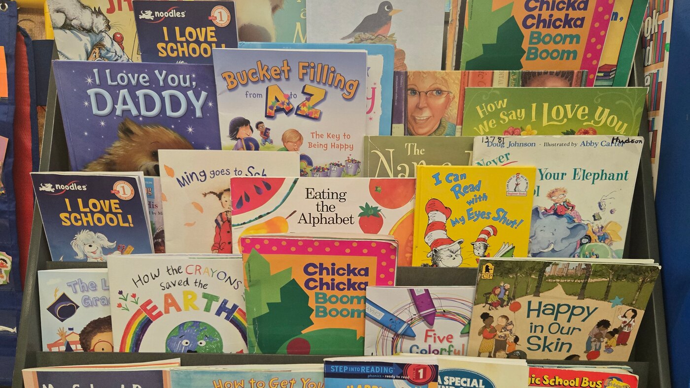 A front-facing rack of picture books in the Apple Valley preschool room